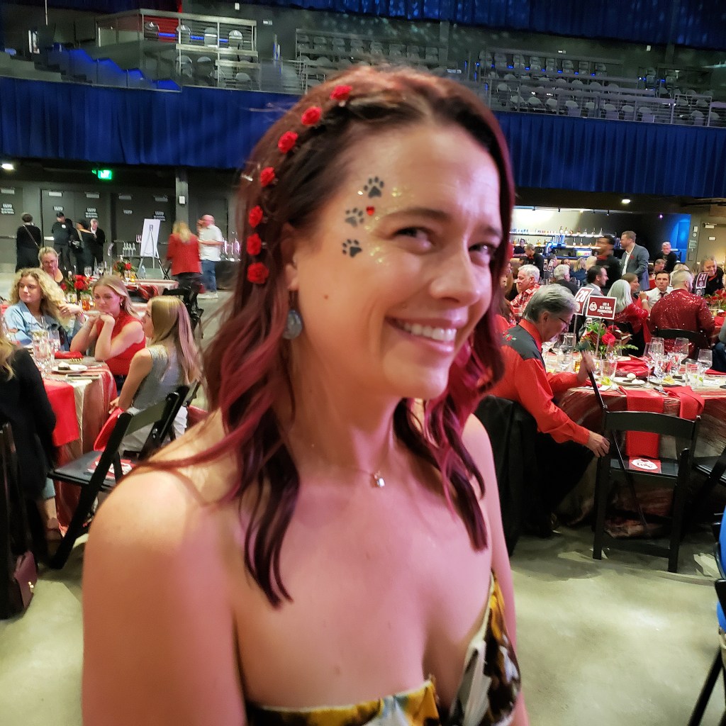 Guest with face painting at Pepper 'Em With Love Fundraiser Gala