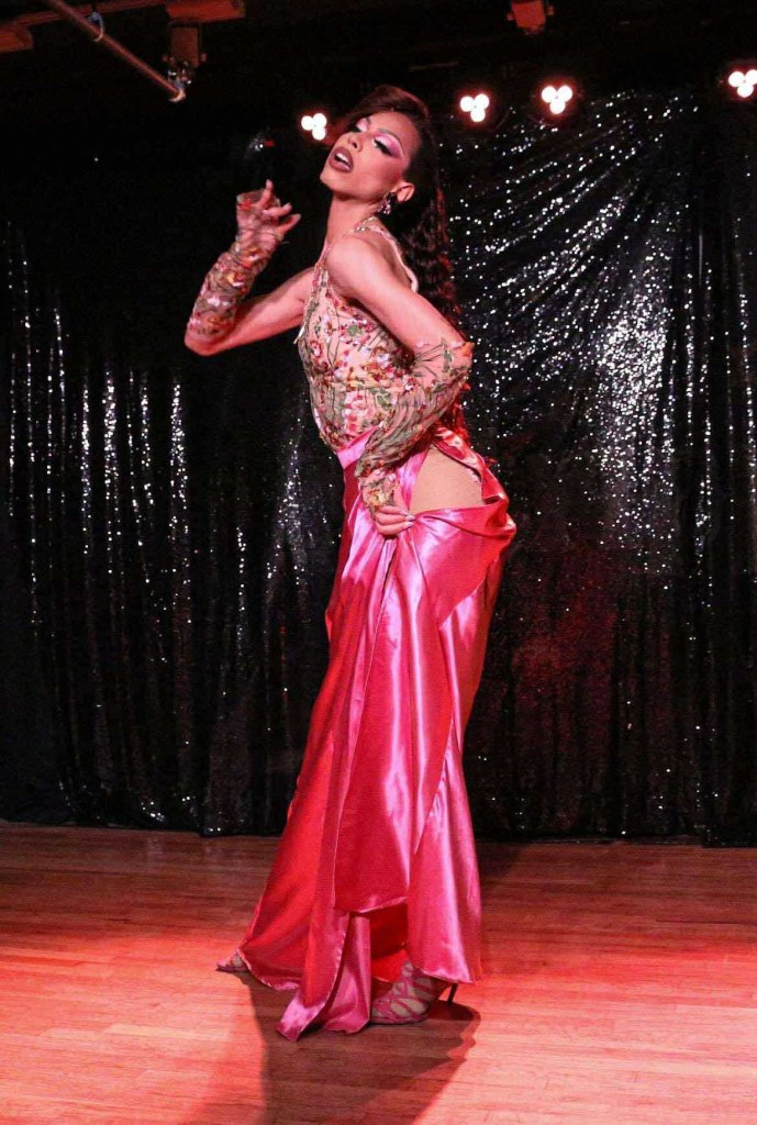 A drag queen in a pink dress