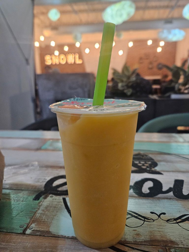 a smoothie on a table.