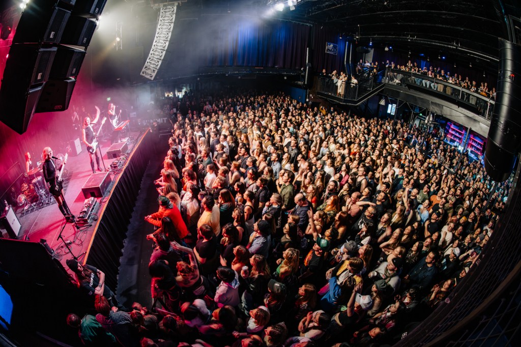A view from above of a band performing in front of an audience.
