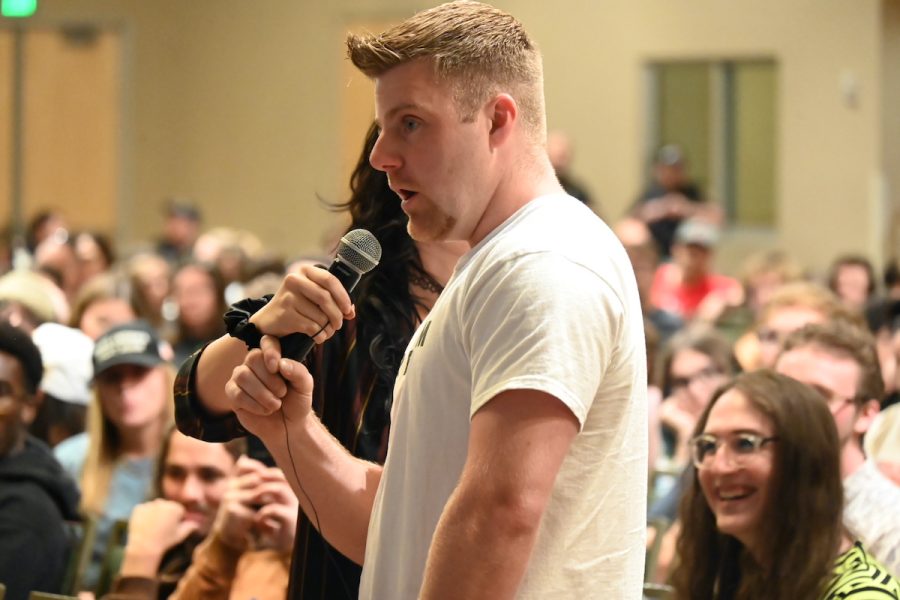 A man asks a question.