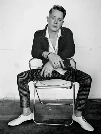 A man sits in a chair