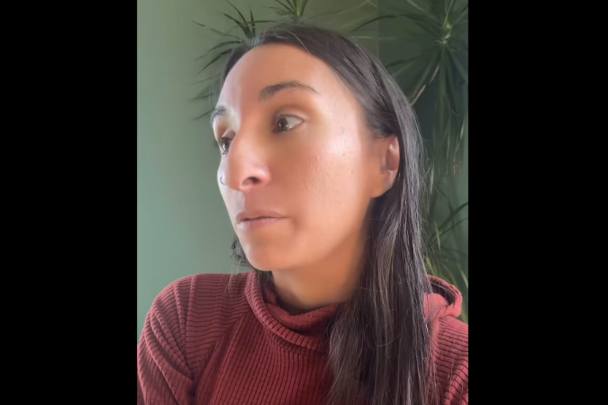 Woman looks off screen