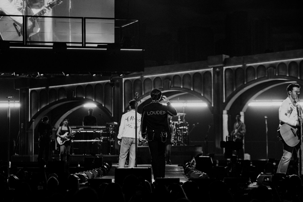 The Jonas Brothers on stage at Ball Arena in Denver, Colorado, for their JONAS20 Greetings From Your Hometown tour.