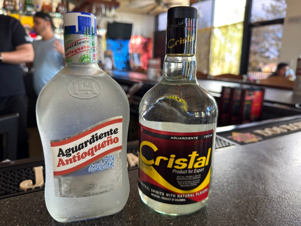 Two types of aguardiente on a bar