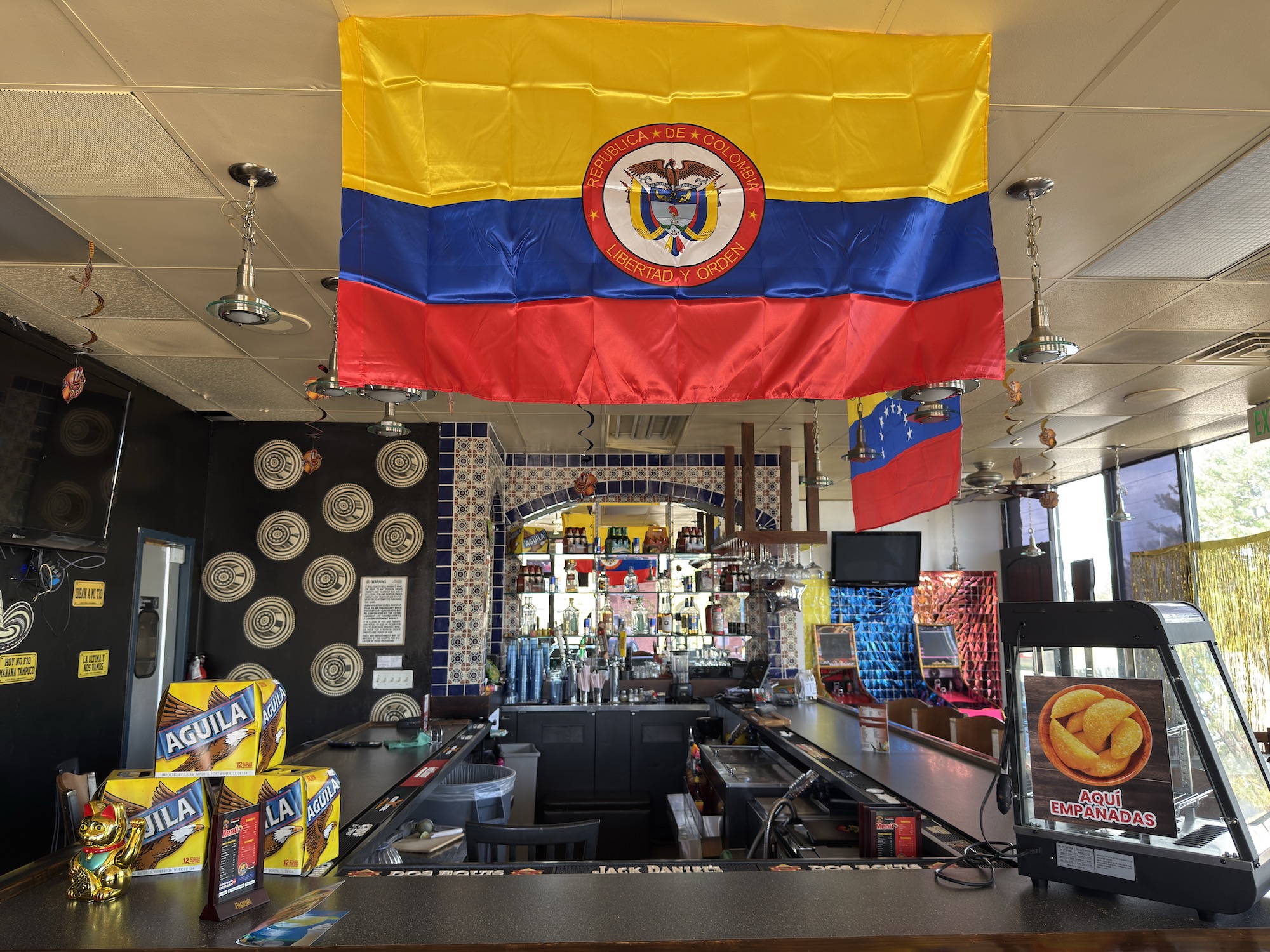 A Colombian flag hanging over a bar