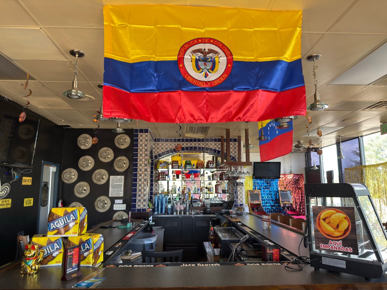 A Colombian flag hanging over a bar