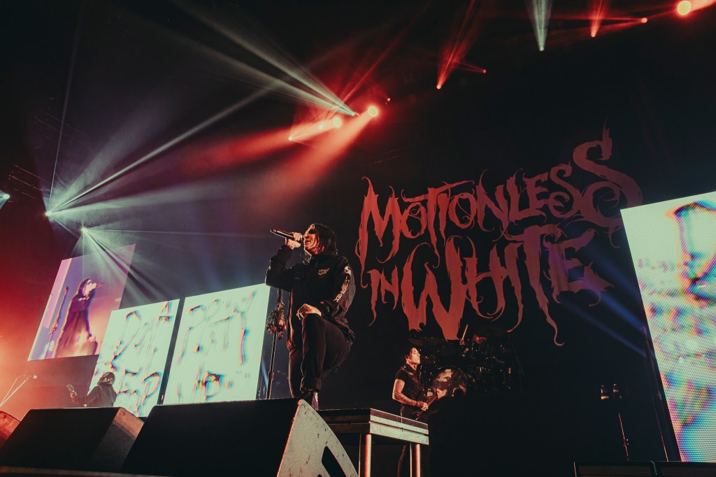 Motionless in White on stage at Ball Arena, opening for Bring Me The Horizon.