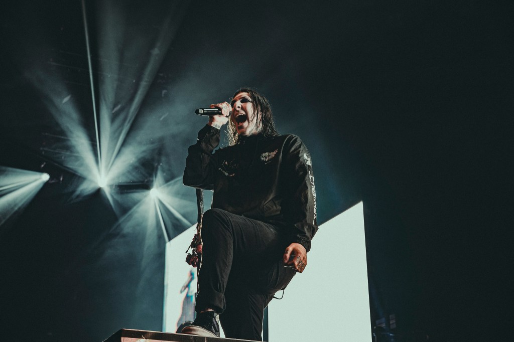 Motionless in White on stage at Ball Arena, opening for Bring Me The Horizon.