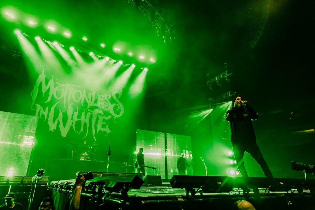 Motionless in White on stage at Ball Arena, opening for Bring Me The Horizon.