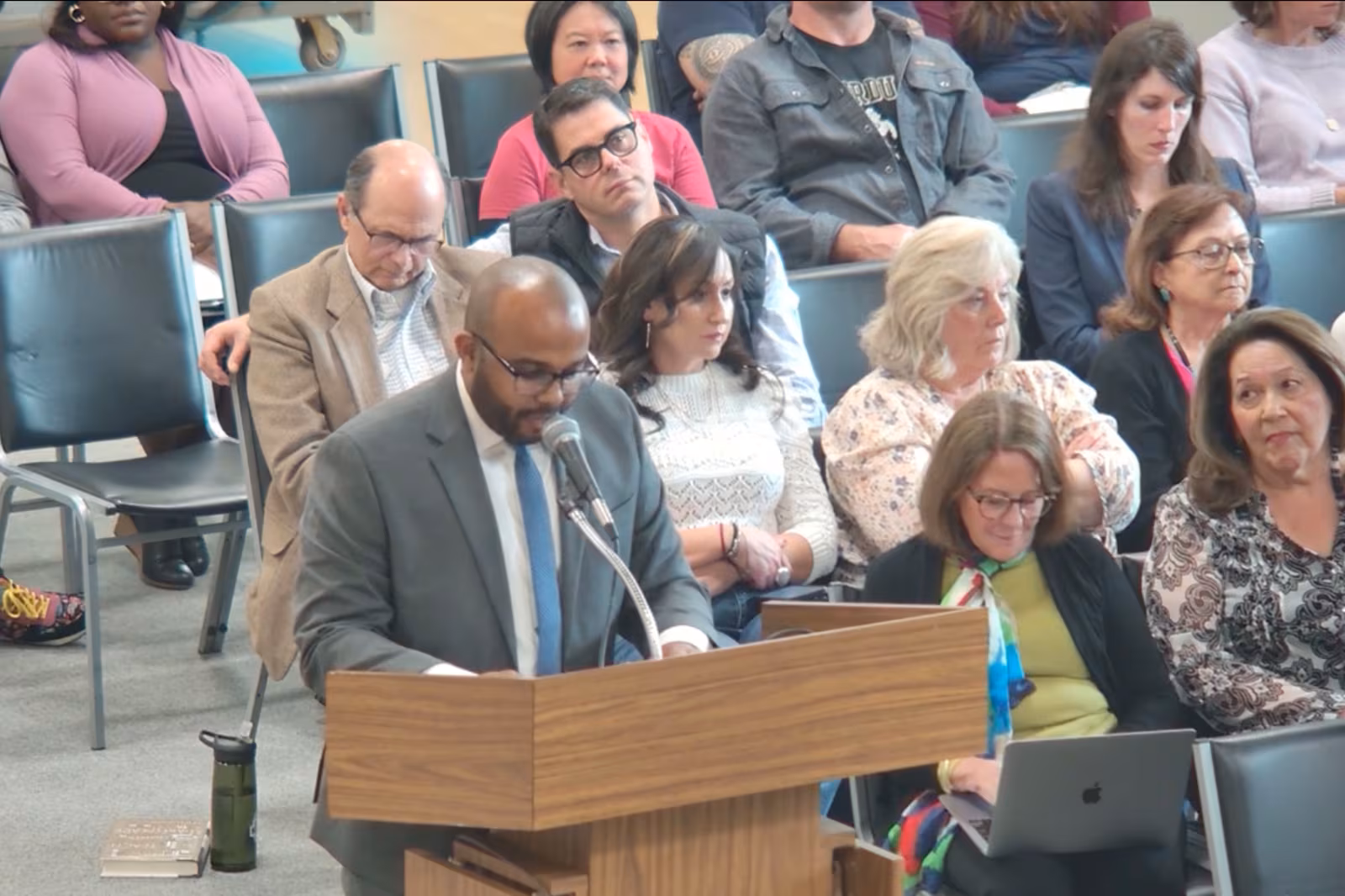 Man speaks during school board hearing