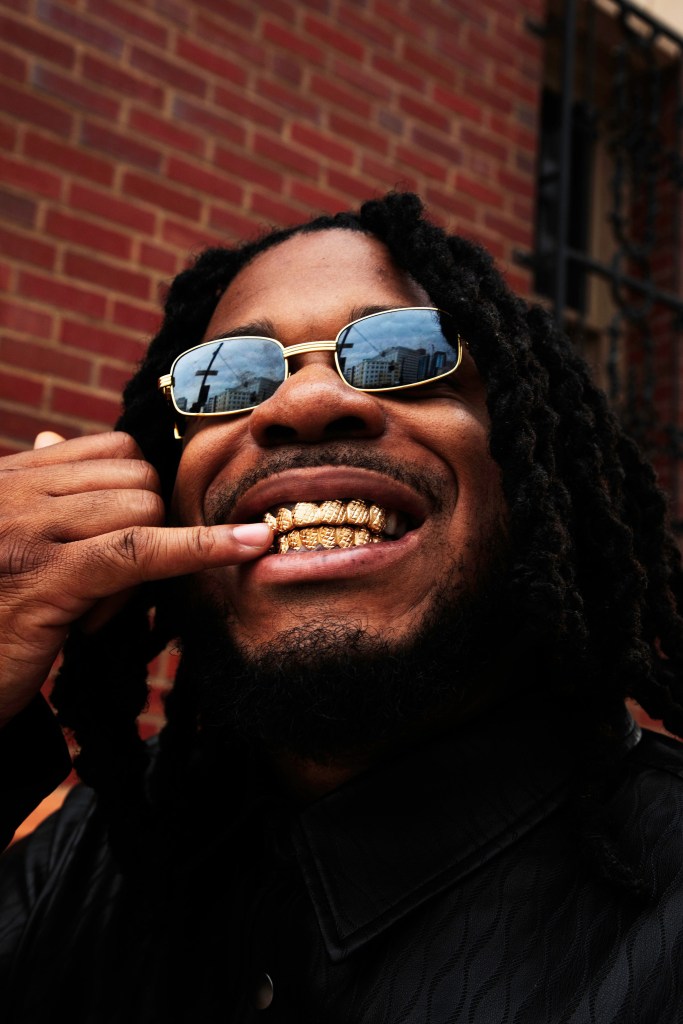 man touching his grill