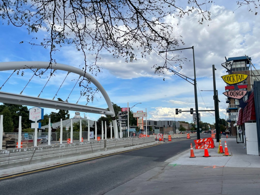 view of a bus stop arch on a street