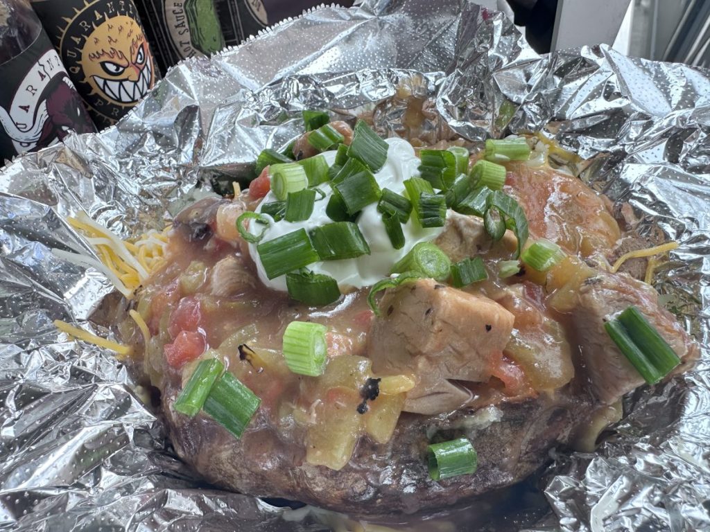 green chile-smothered baked potato