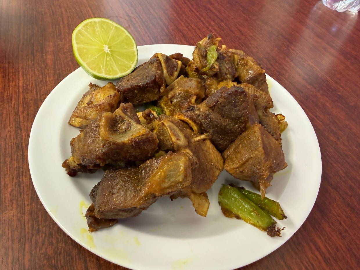a plate of braised goat