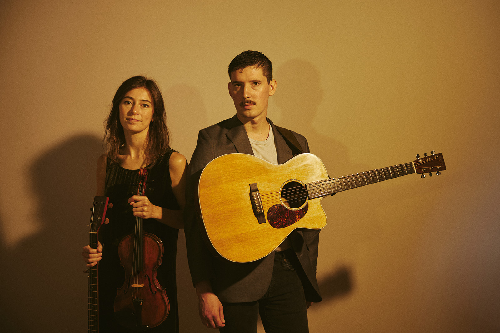 woman and a man with a guitar