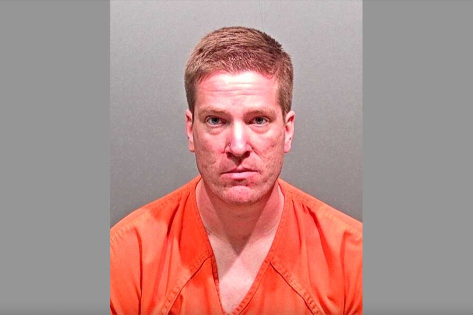 mugshot of prisoner in orange uniform