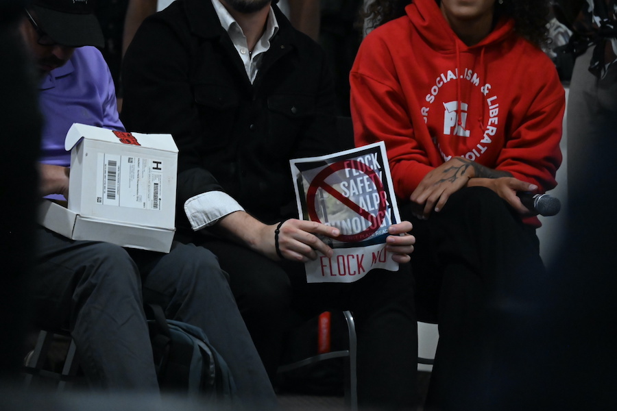 anti-flock protesters at a town hall