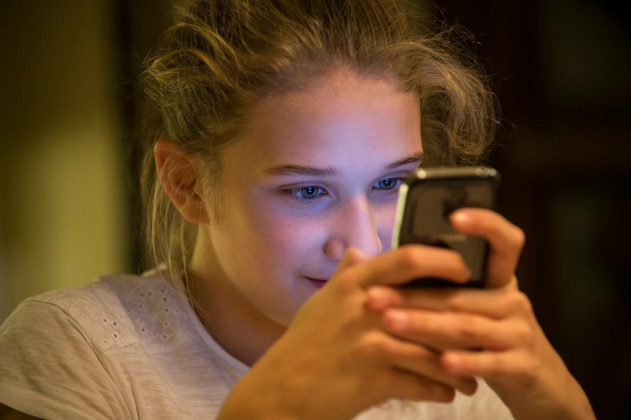 girl tests on cell phone