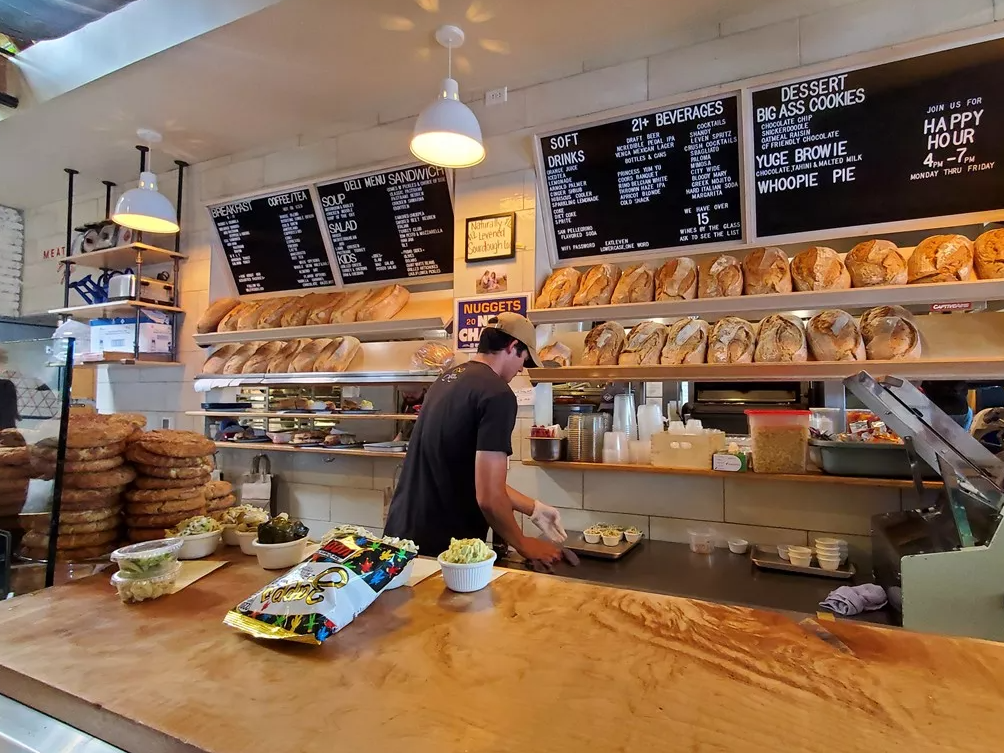 person behind a deli counter