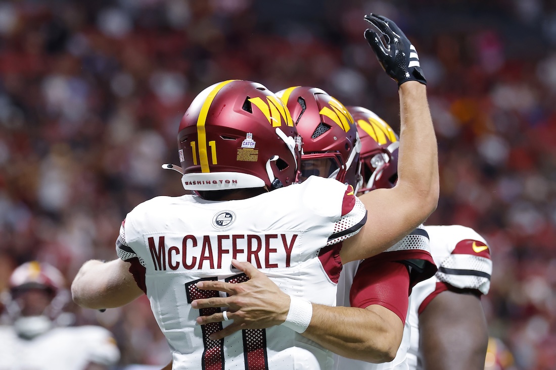 Luke McCaffrey #11 of the Washington Commanders celebrates a touchdown during the second quarter against the Atlanta Falcons at Mercedes-Benz Stadium on September 28, 2025 in Atlanta, Georgia.