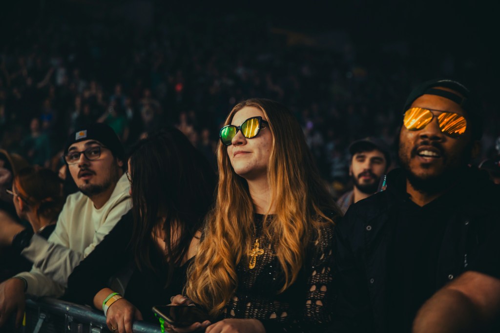 A photo showing a concertgoer front row at Justice.