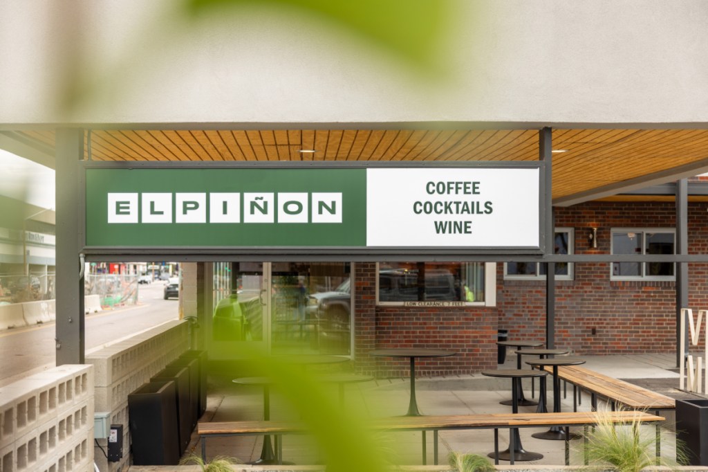 sign for a coffee shop and bar