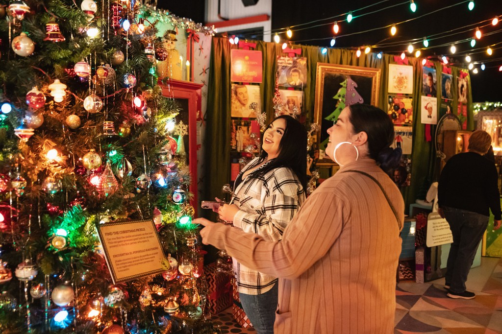 People look at the Camp Christmas display.
