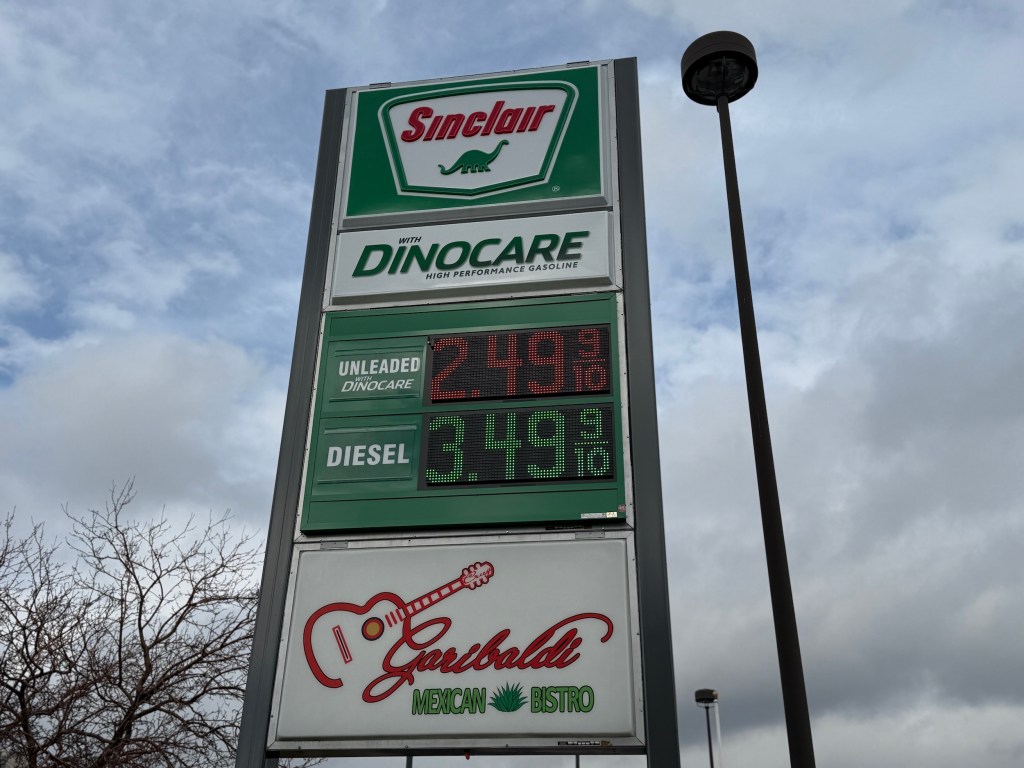 a gas station and restaurant sign