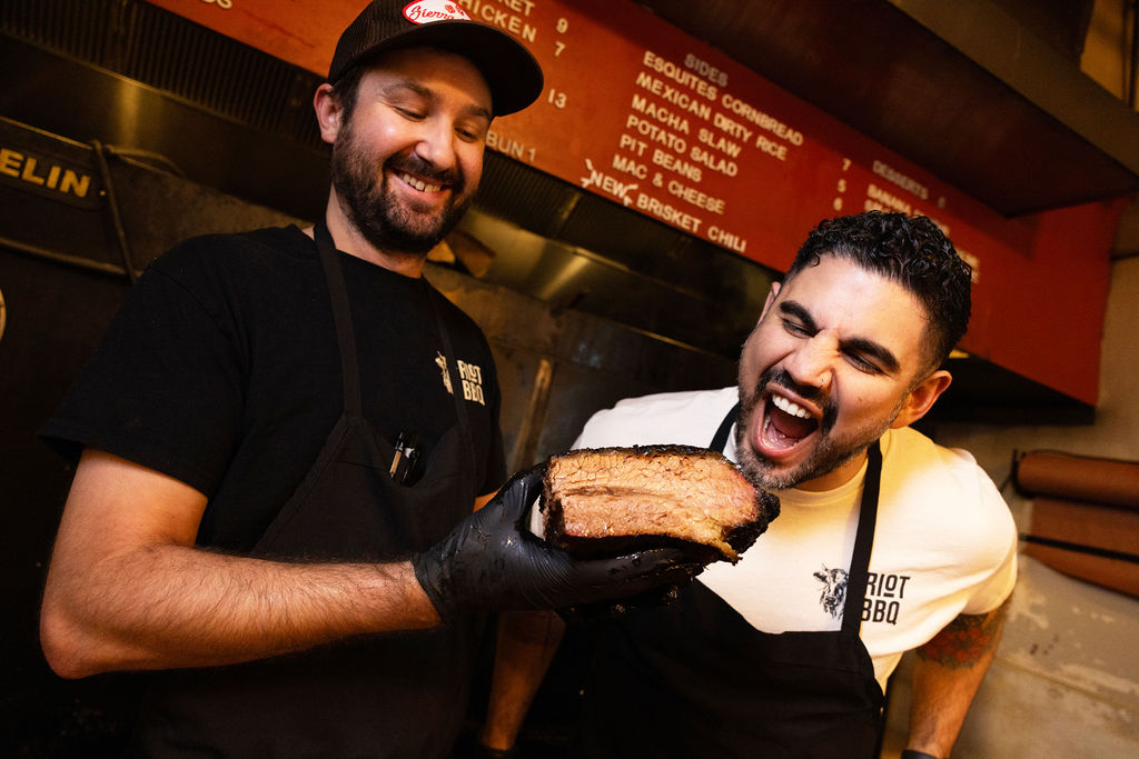 two men with a brisket