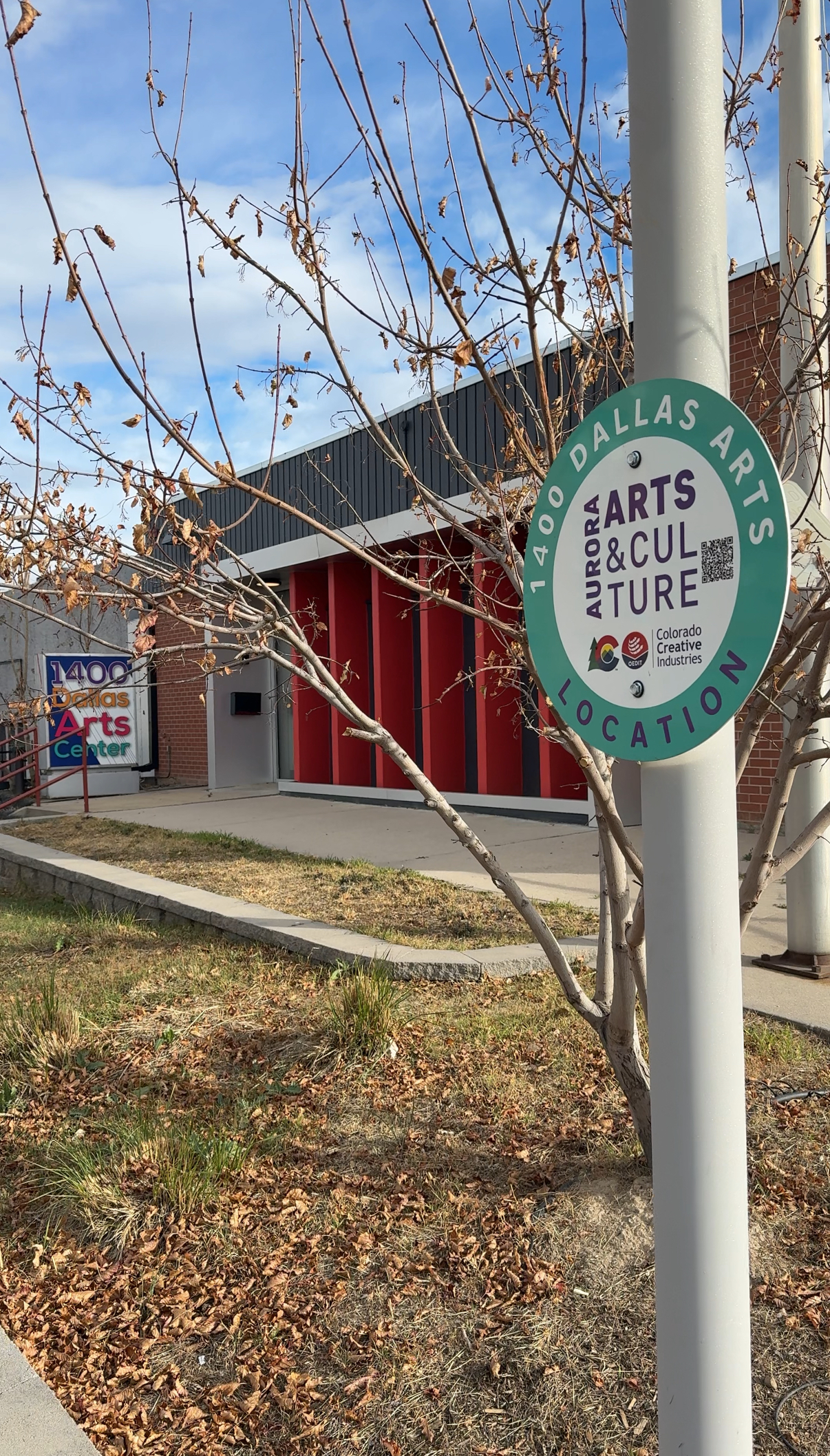 Exterior of building with Aurora Cultural Arts District sign.