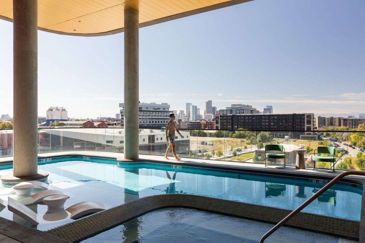 A person walks at a pool
