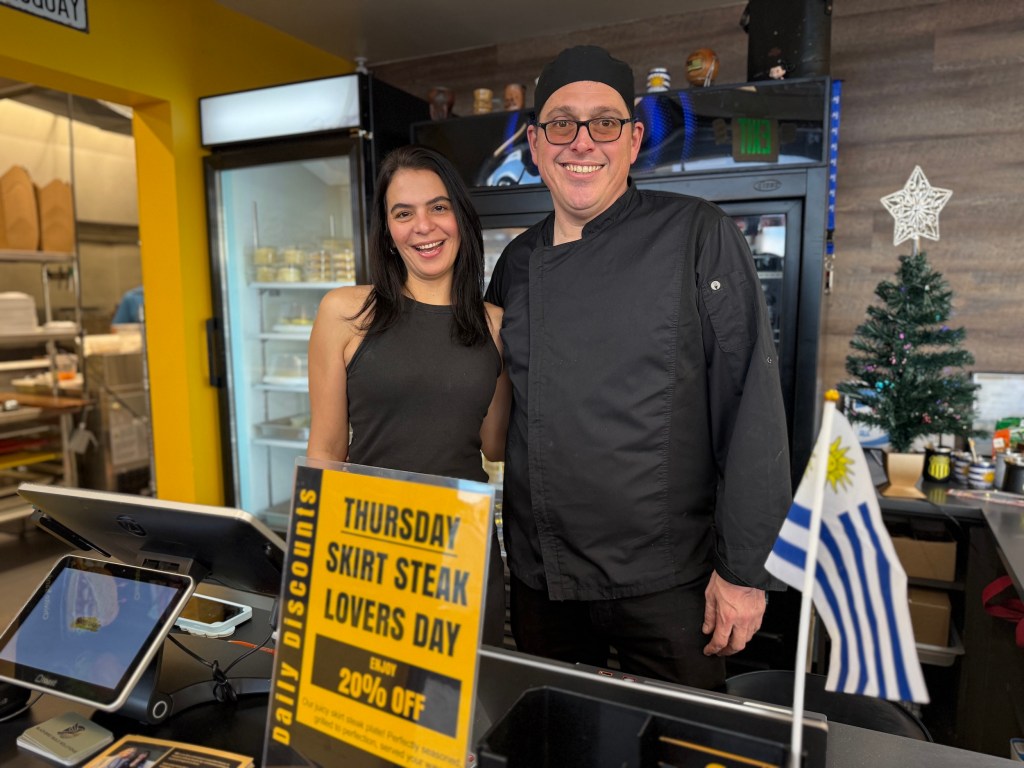 restaurant owners behind counter