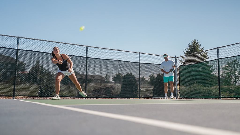 Two people playing pickleball