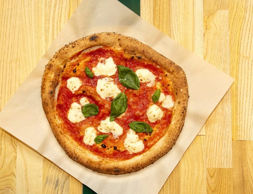 Neapolitan-style pizza on a wooden table