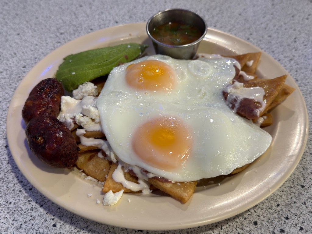 a plate of eggs and sausage