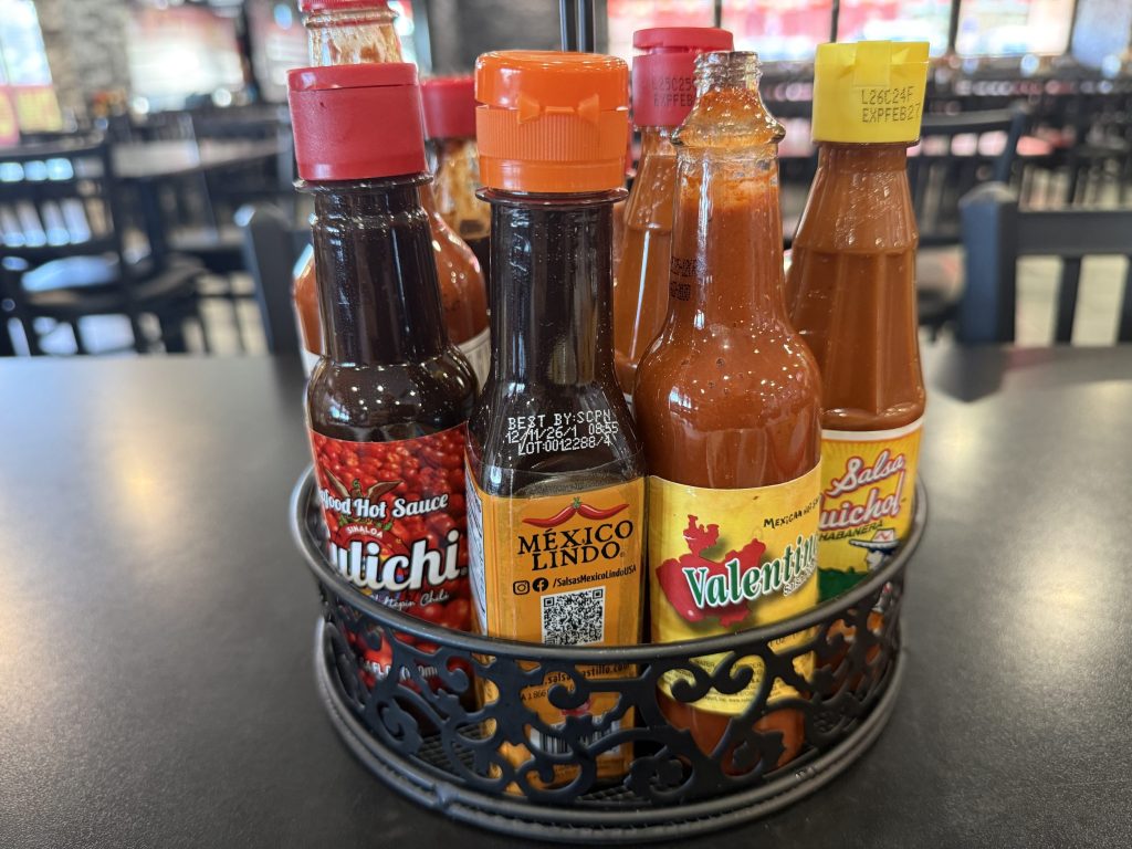 a caddy of hot sauce