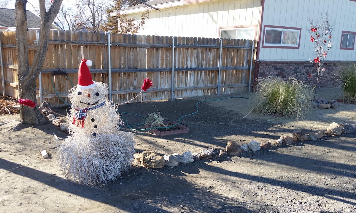 fake snowman in desert