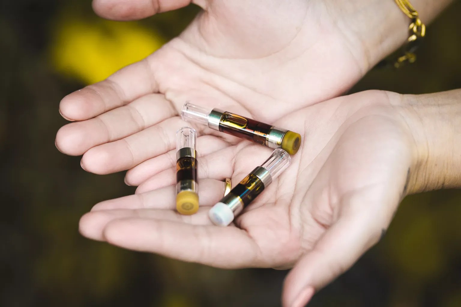 handful of vape cartridges