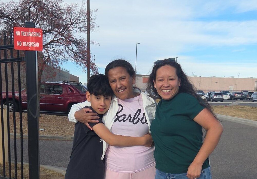 woman greets family