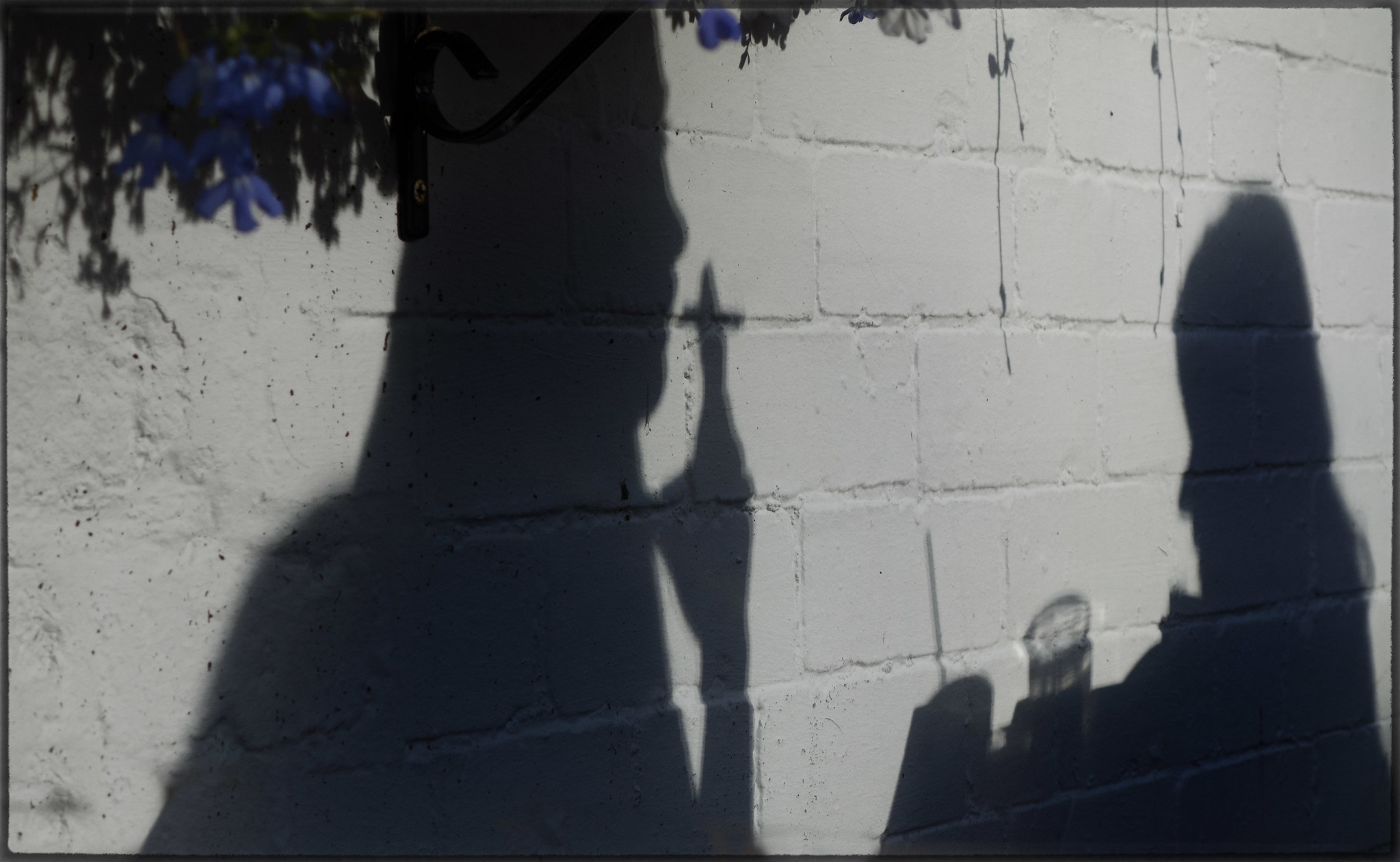 shadows of people drinking and smoking