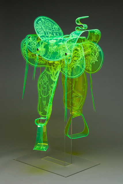 A green saddle made of plexiglass