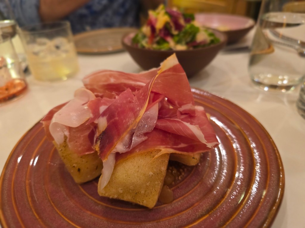 Italian frie dough topped with cured meat