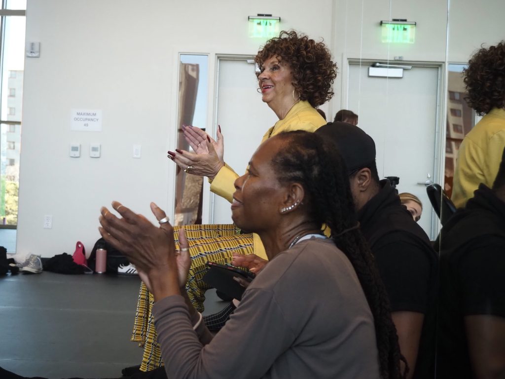 People clap in a dance studio