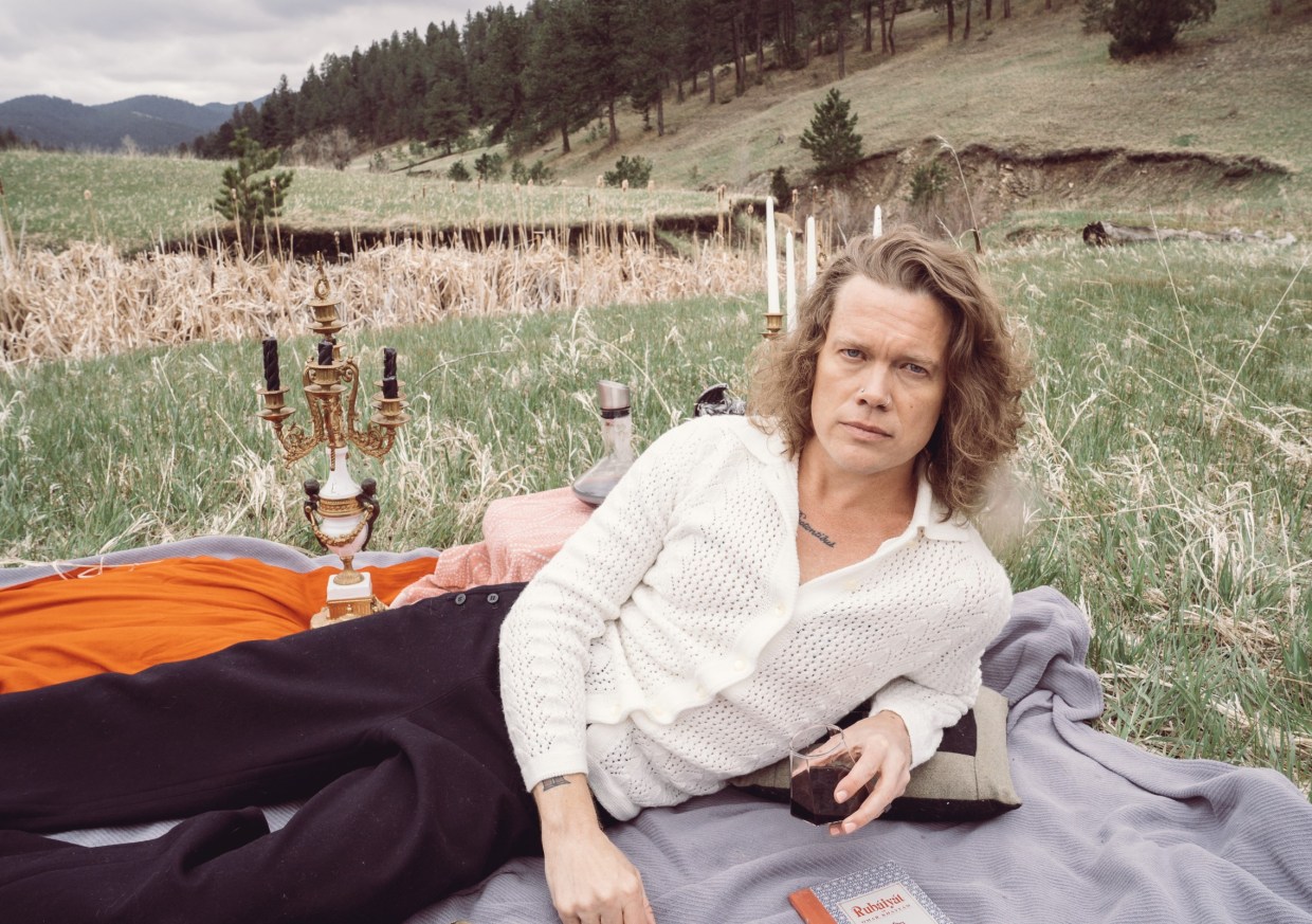 A portrait of a person in a field