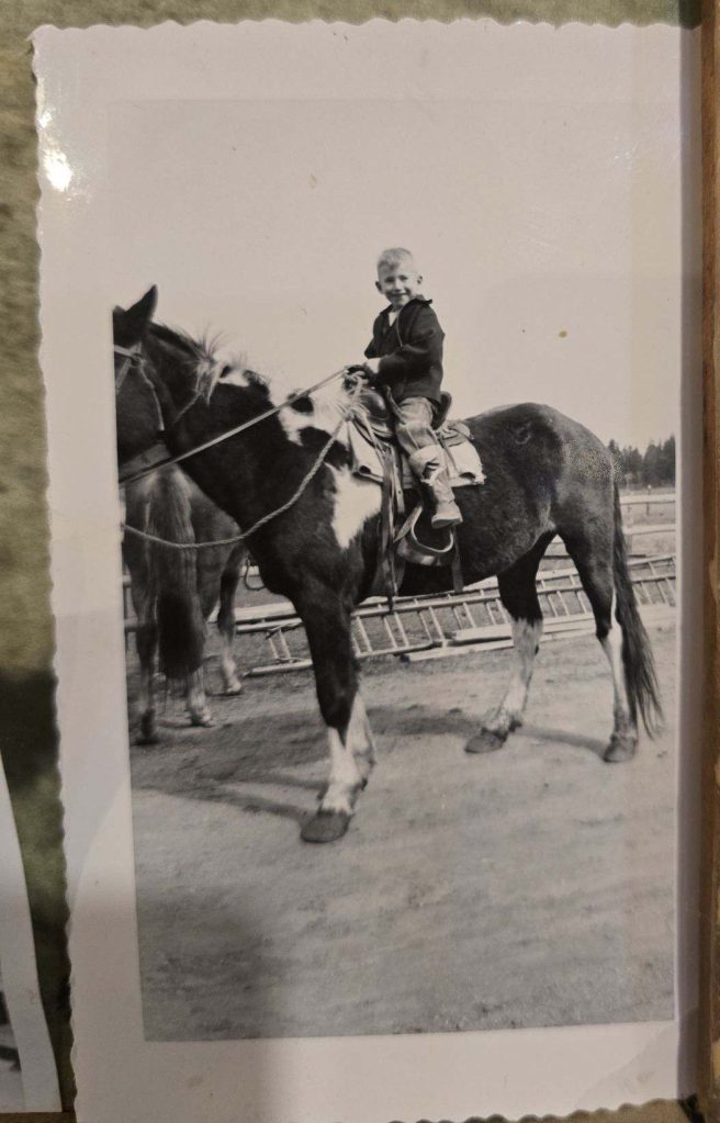 an old picture of a boy on a horse