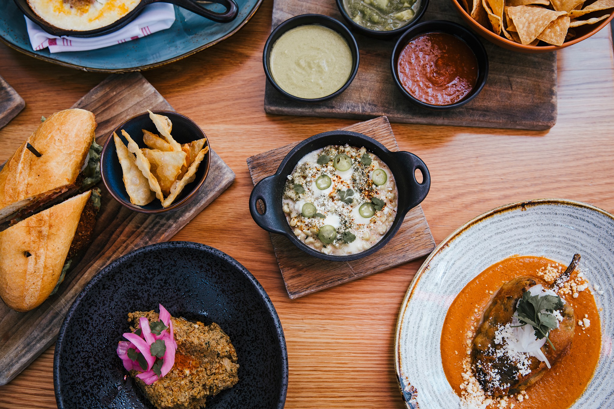 various Mexican dishes on a table
