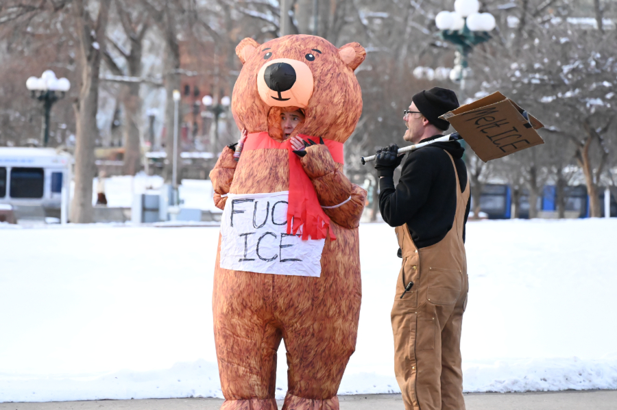 woman protests in bear costume