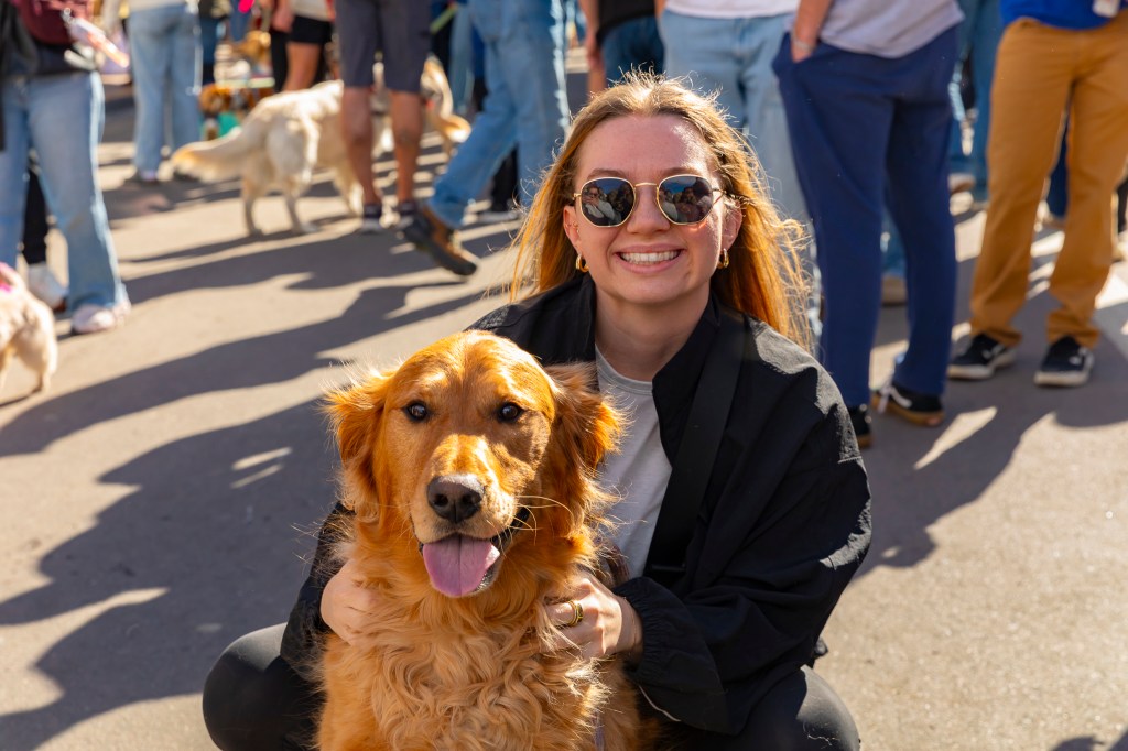 A photo of a woman and a dog during the annual Golden's in Golden event.