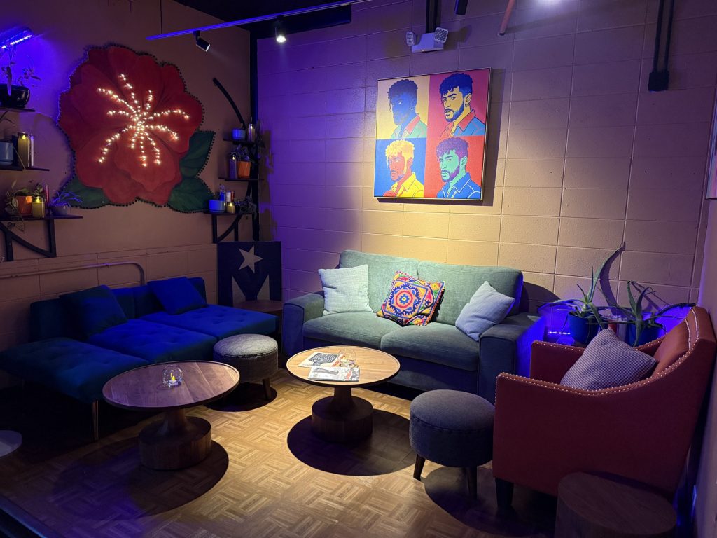 a lounge with couches and murals